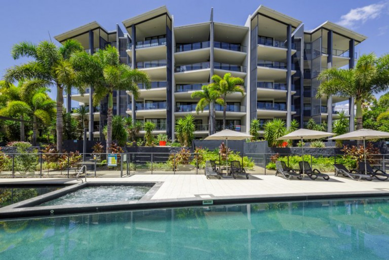 View from the pool area to the apartments